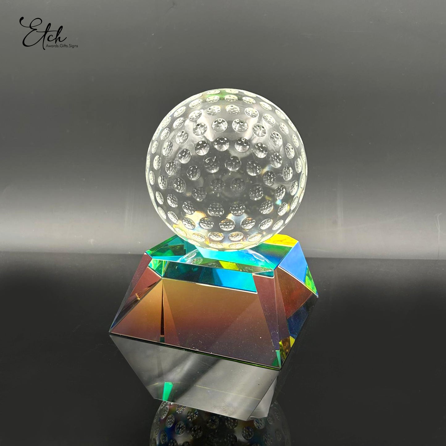 Clear Golf Ball on Radiant Base