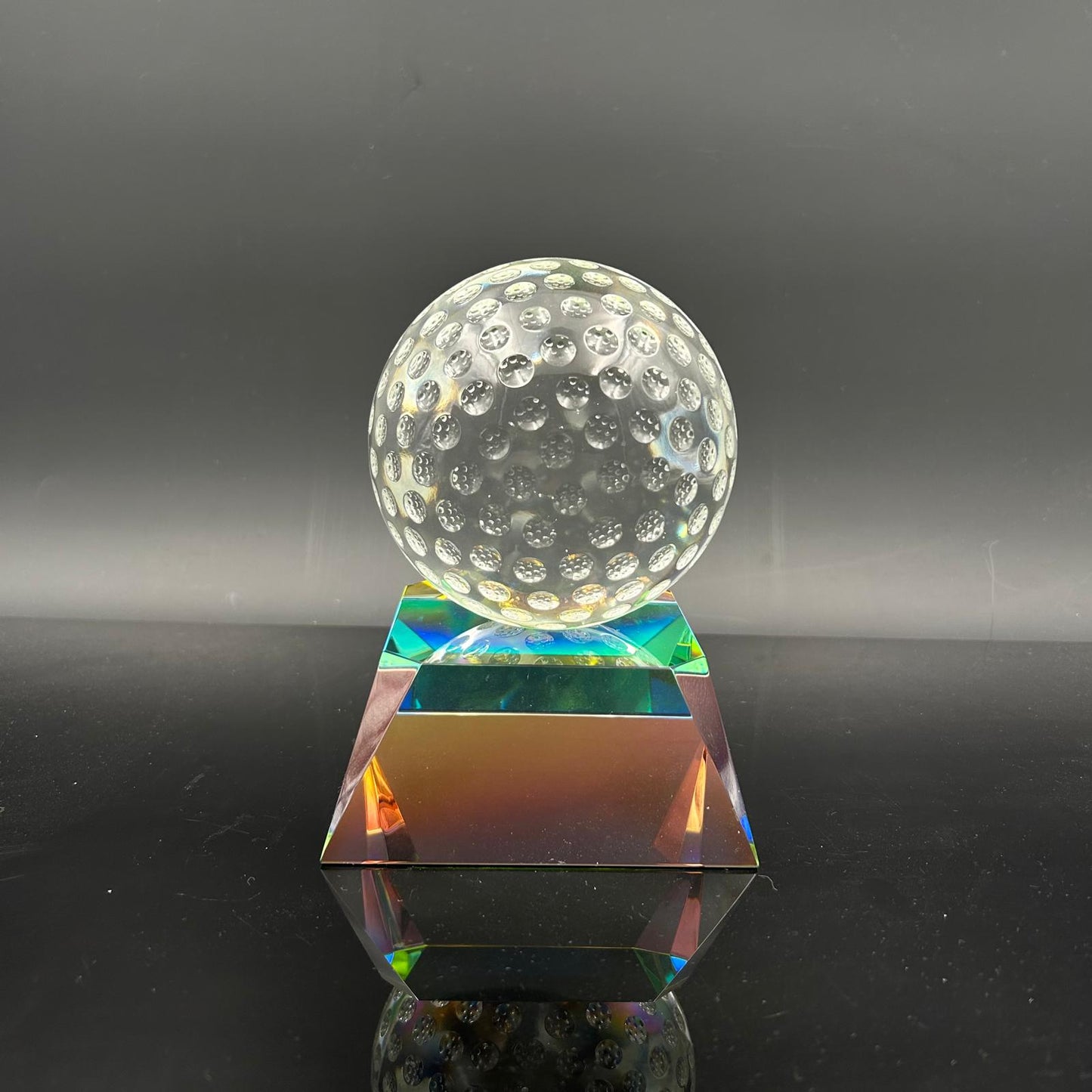 Clear Golf Ball on Radiant Base