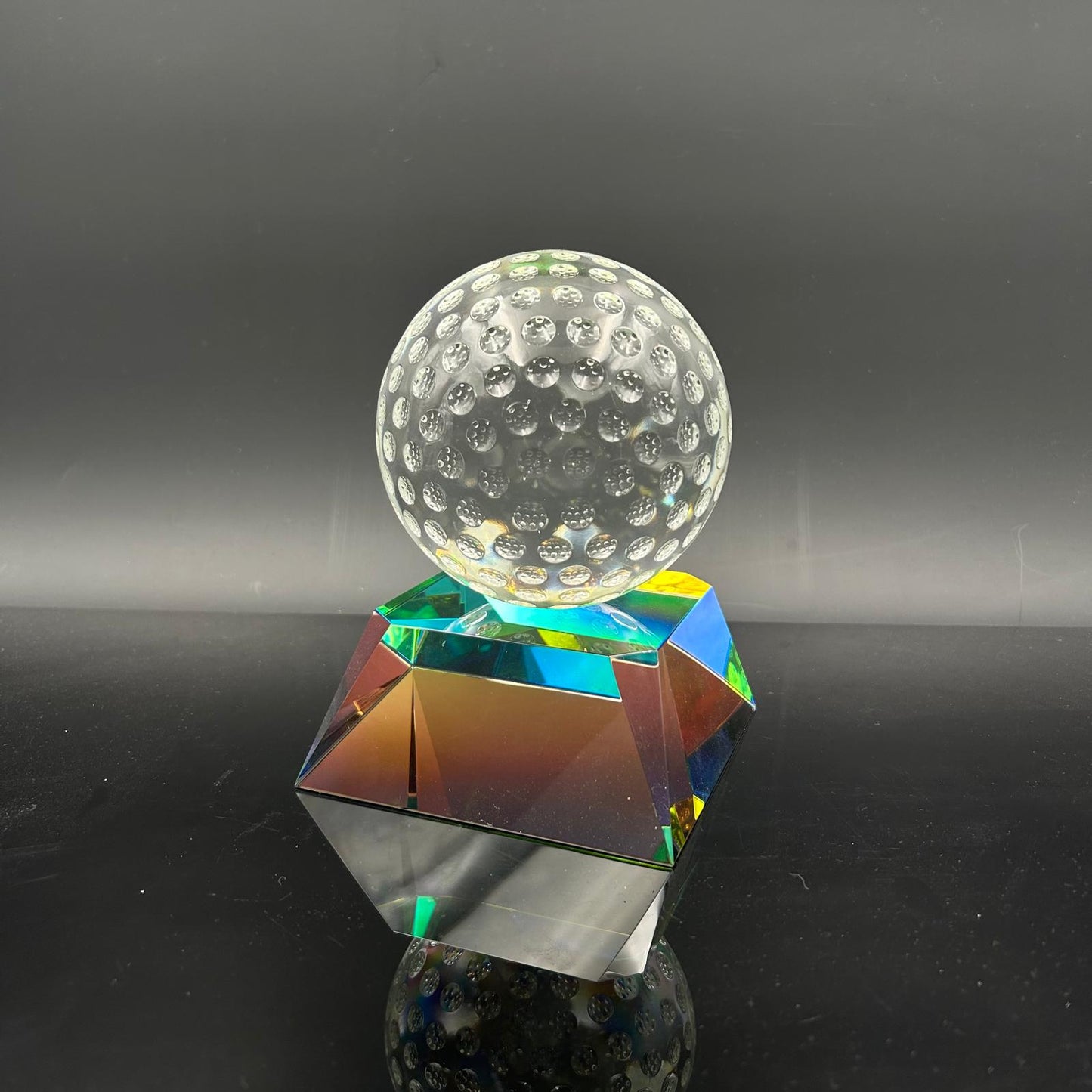 Clear Golf Ball on Radiant Base